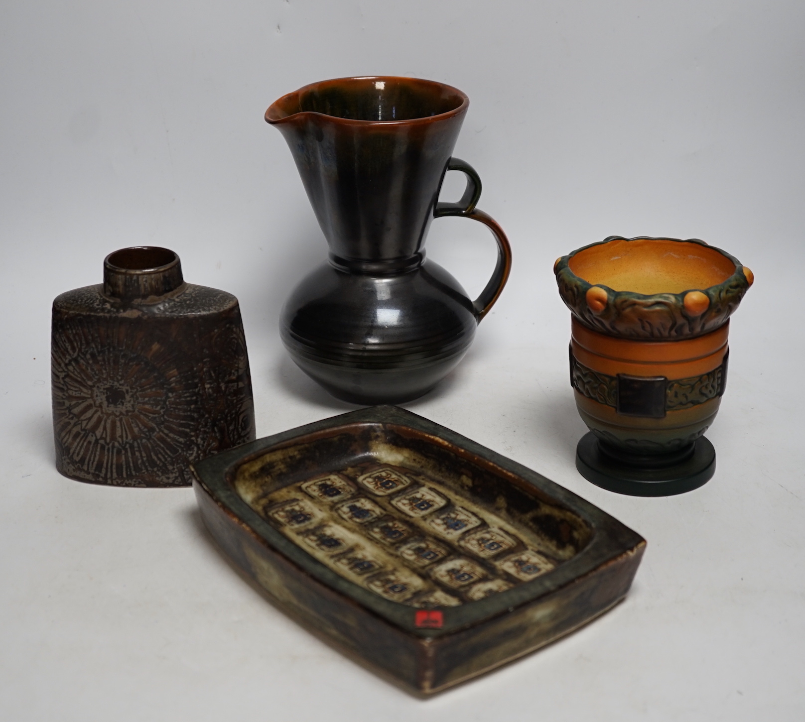 Danish ceramics, including a Royal Copenhagen rectangular shallow dish, a Royal Copenhagen vase, a pedestal vase, and a Dissing, Denmark jug, tallest 19cm